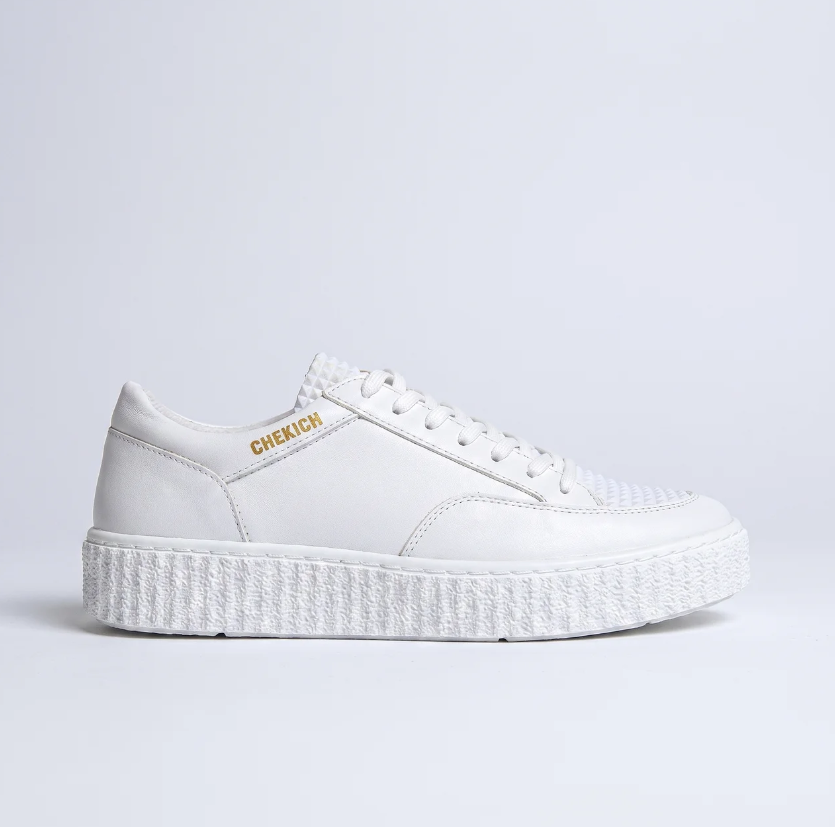 White Pyramid sneakers by Shopify featuring a sleek design and comfortable fit, shown in a close-up view.