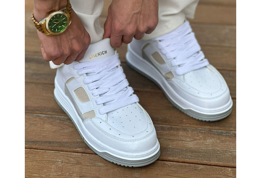 White Blur sneakers by Shopify featuring cream accents, casual athletic shoes with stylish design and comfortable fit.