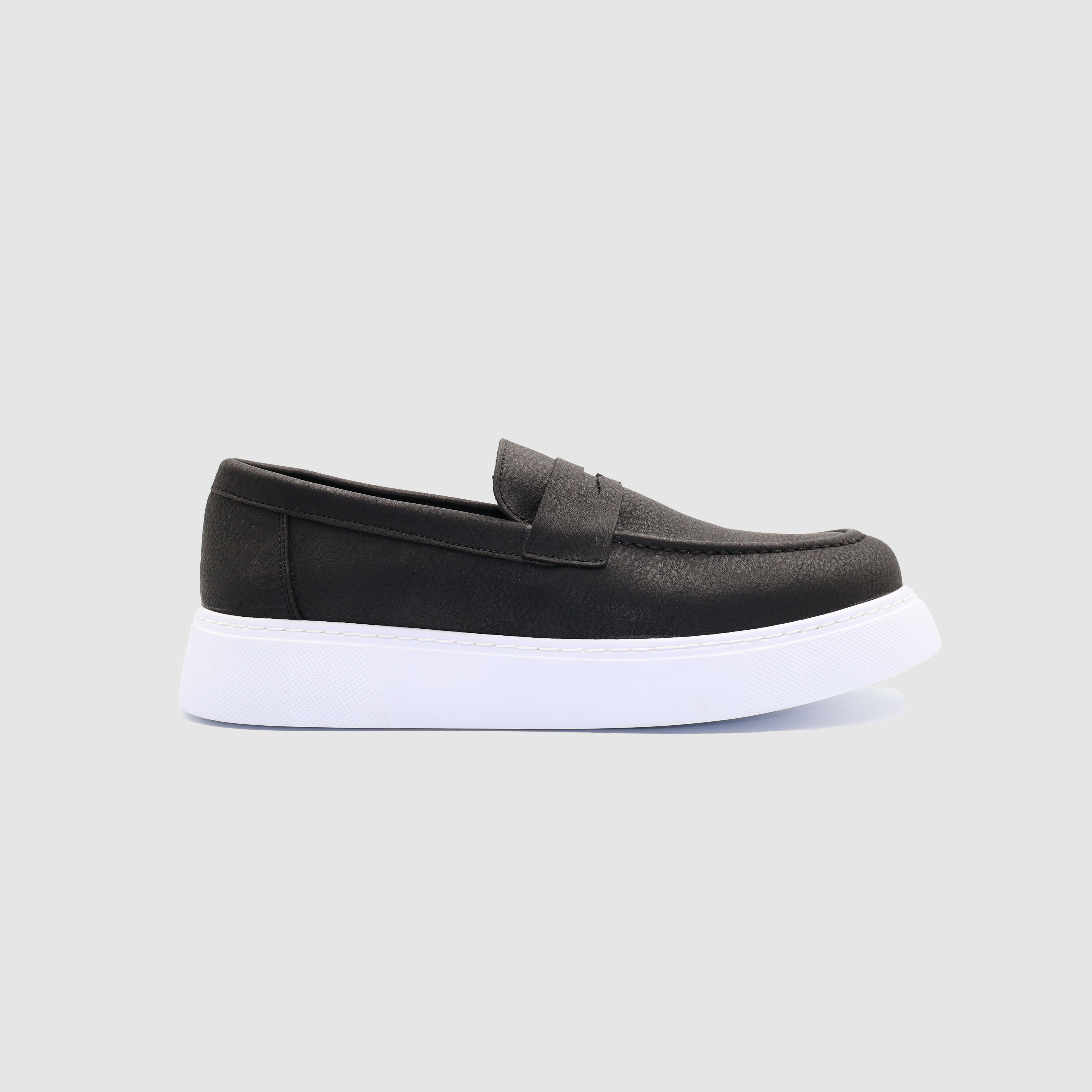 Black LOOM loafers by Shopify, stylish slip-on shoes with a sleek design, featuring white soles and a comfortable fit.