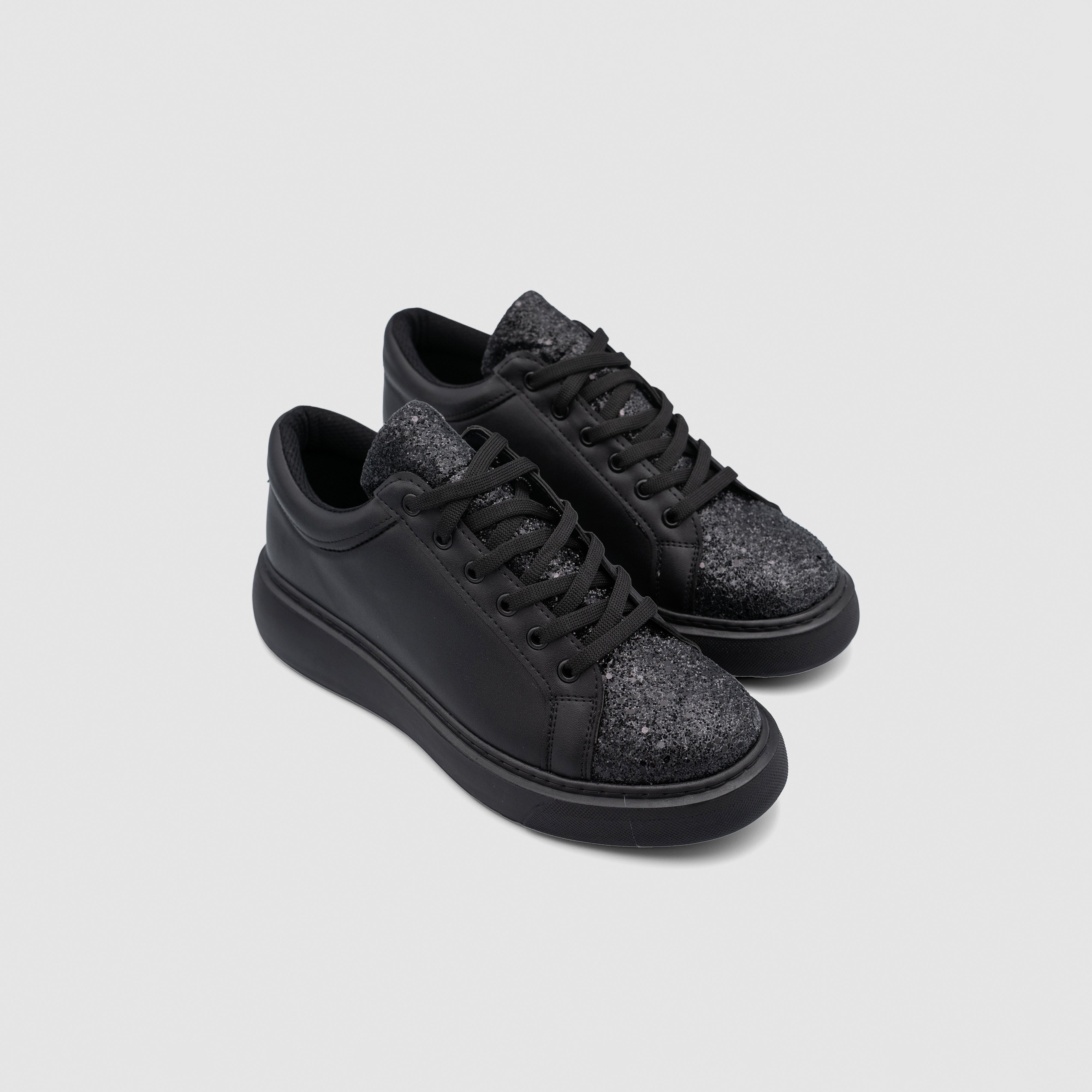 Shopify Nova Black sneakers with sleek black design, stylish laces, and comfortable sole for everyday wear.