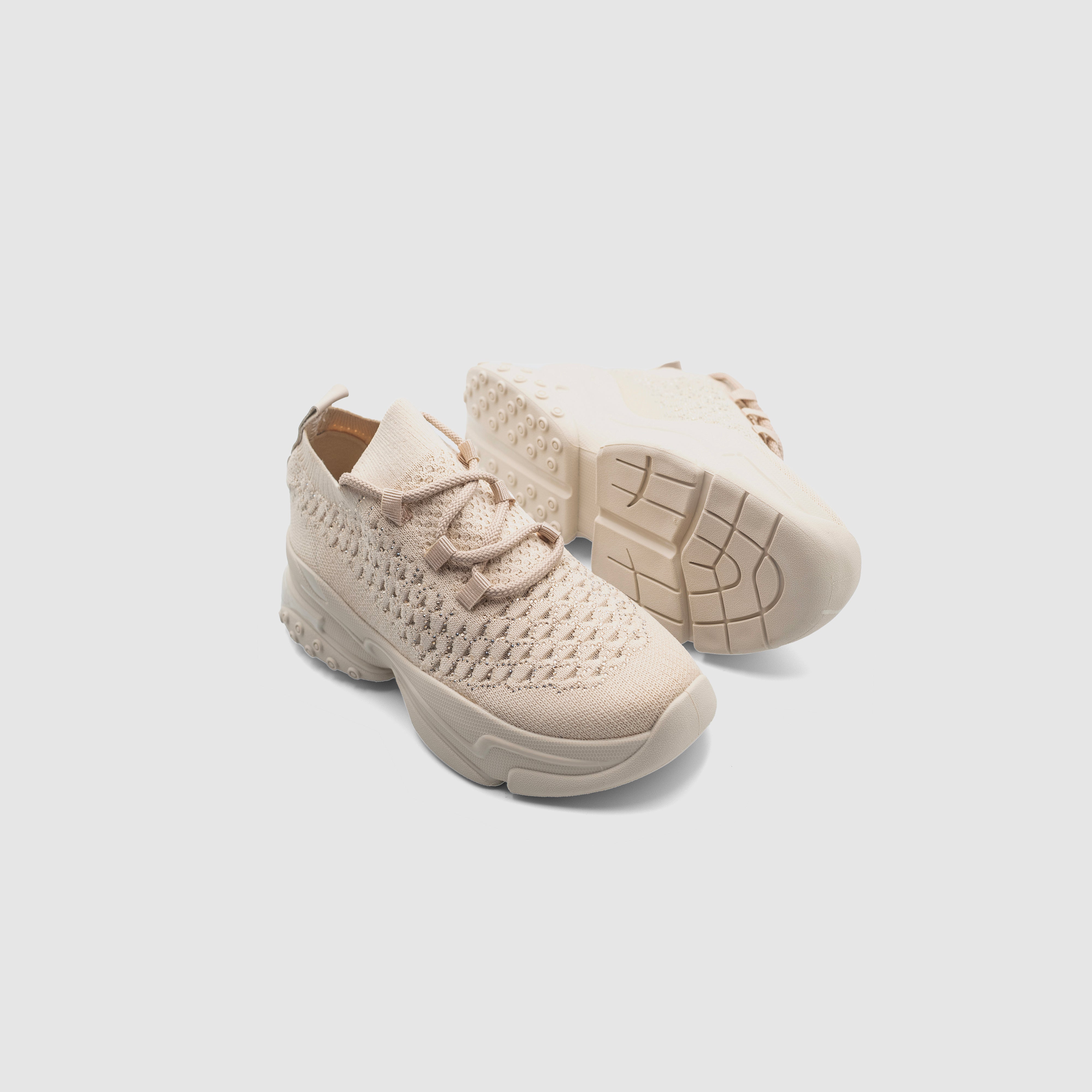 Beige PNut sneakers by Shopify featuring a sleek design, cushioned sole, and stylish appearance for casual wear.