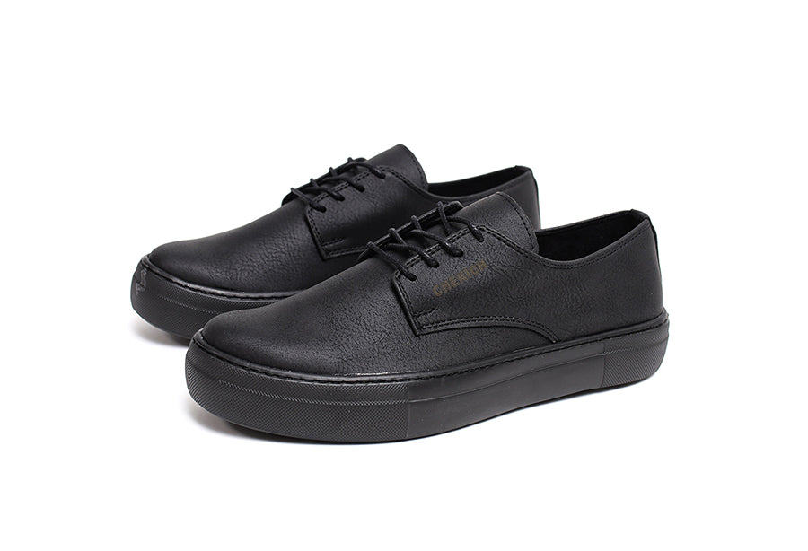 Black Pitti sneakers by Shopify with sleek design, featuring smooth black material and lace-up closure.