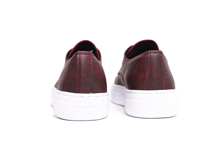 Shopify Pitti Burgundy sneakers in burgundy color with stylish design and white sole, shown from side angle.