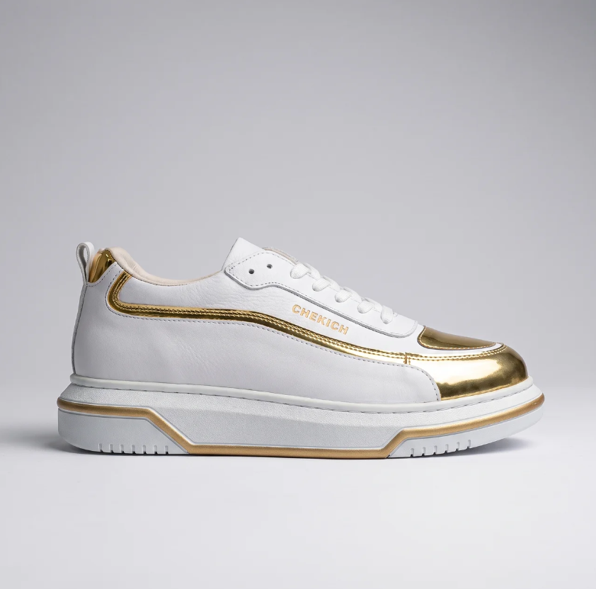 Chekich South Africa SIGNATURE LINE UP Gold sneakers shown from side, featuring gold accents and modern sneaker design.