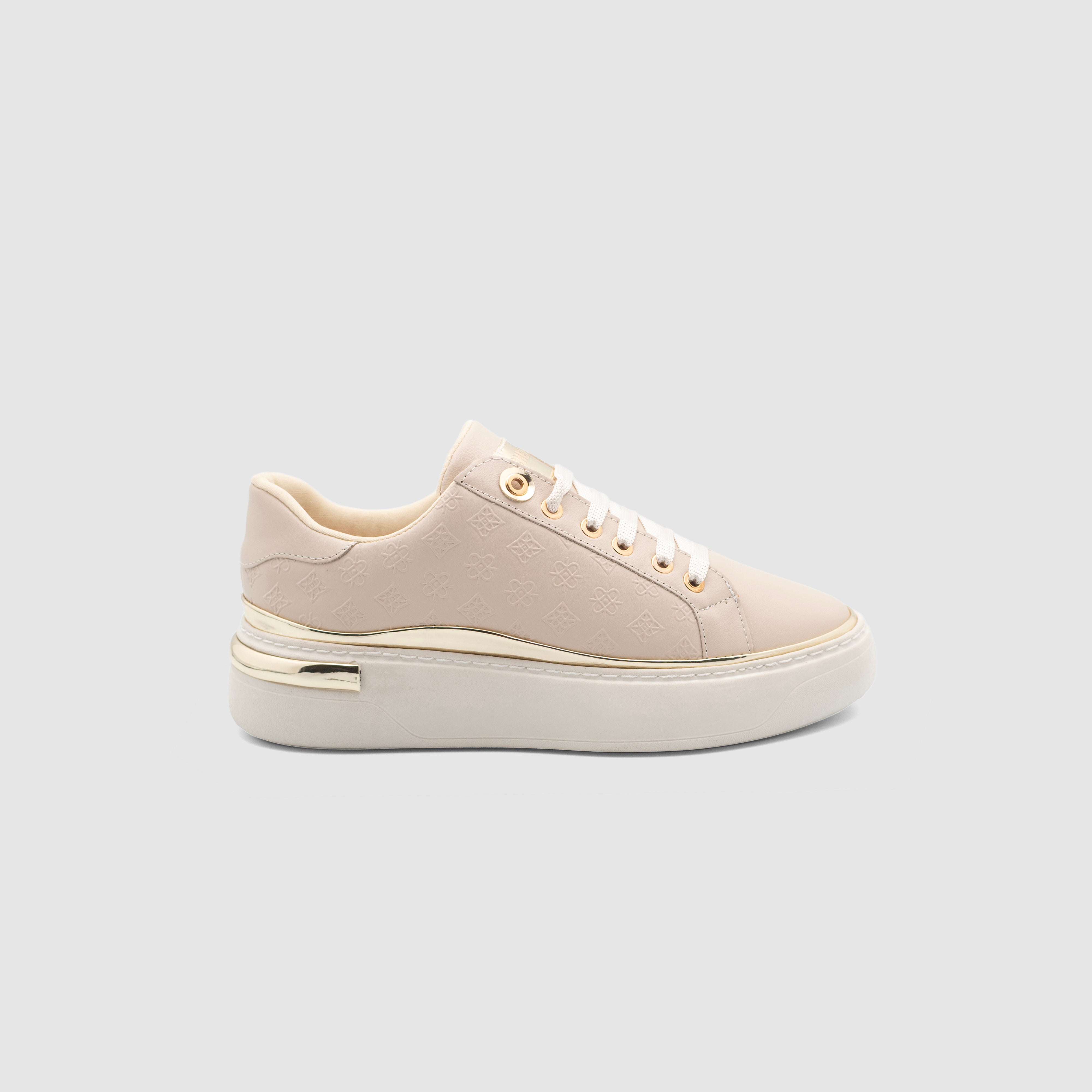 Beige Shopify sneakers with white soles and minimal design, displayed on a plain background.