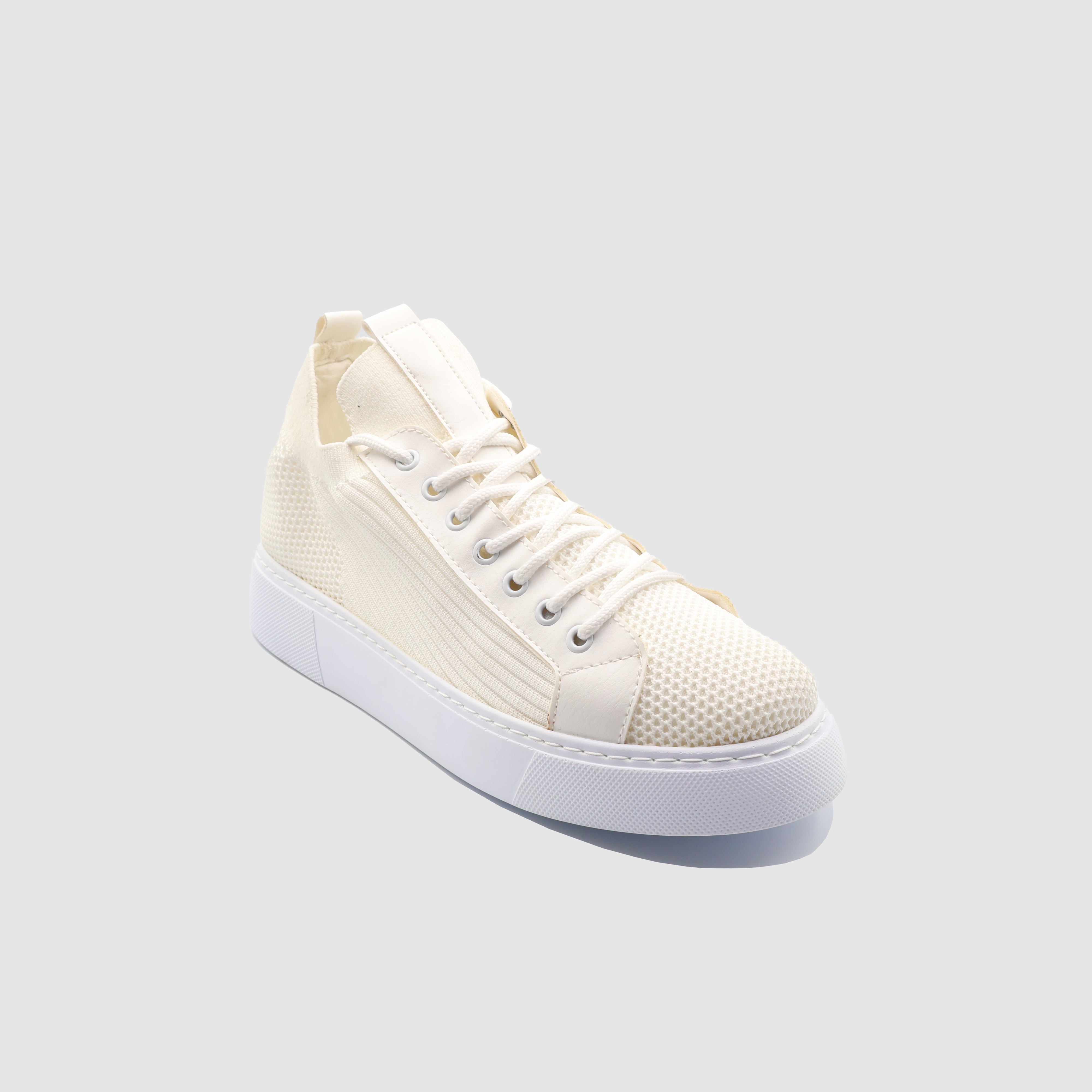 White SAGA sneakers by Shopify, featuring a sleek design with laces and cushioned soles, ideal for casual and athletic wear.