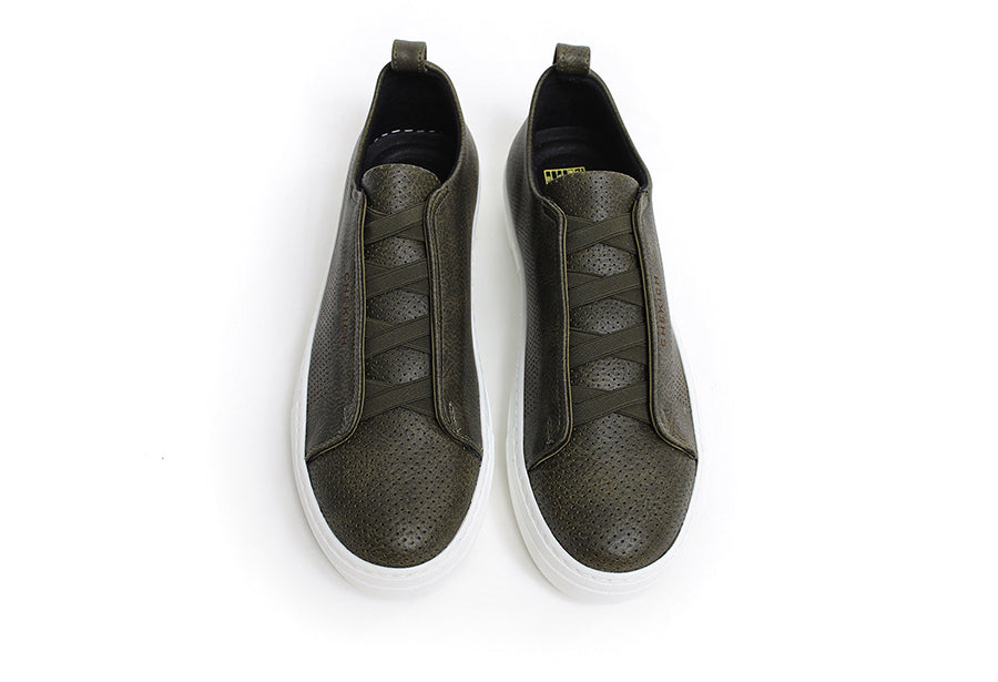 Navy ZEN sneakers by Shopify, featuring stylish design and comfortable fit, shown from a side view with laces and sole detail.