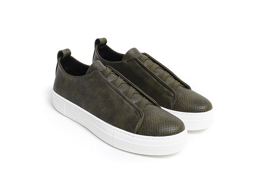 Navy ZEN sneakers by Shopify featuring a sleek design and comfortable fit, shown from a side view in the image.