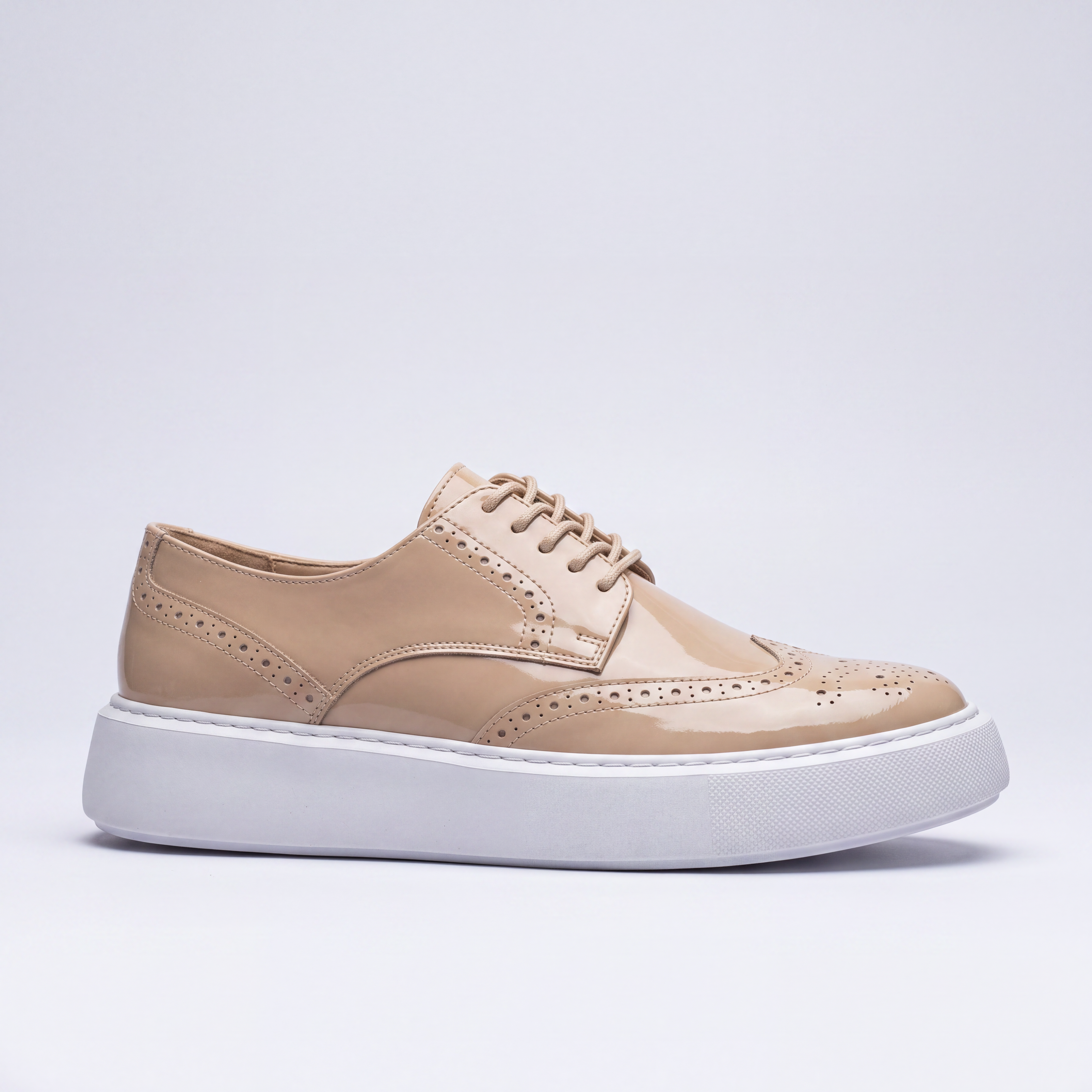Beige Shopify KULUP sneakers with white soles and minimalist design, shown on a plain background.