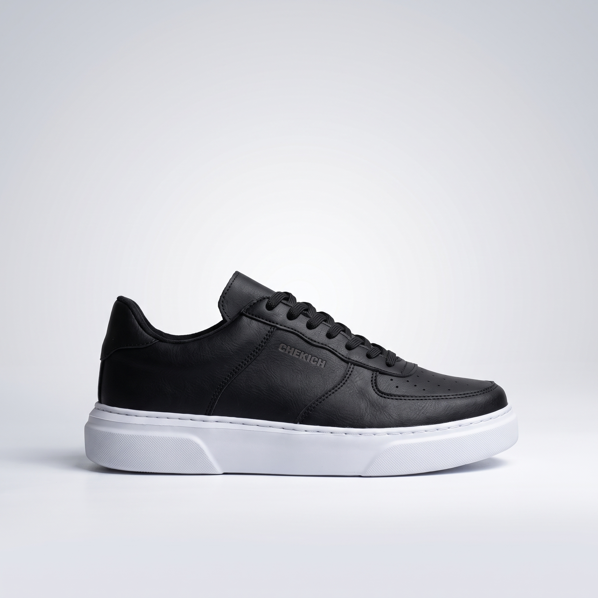 Flatline black and white sneakers by Chekich South Africa, featuring a sleek design with contrasting color accents.
