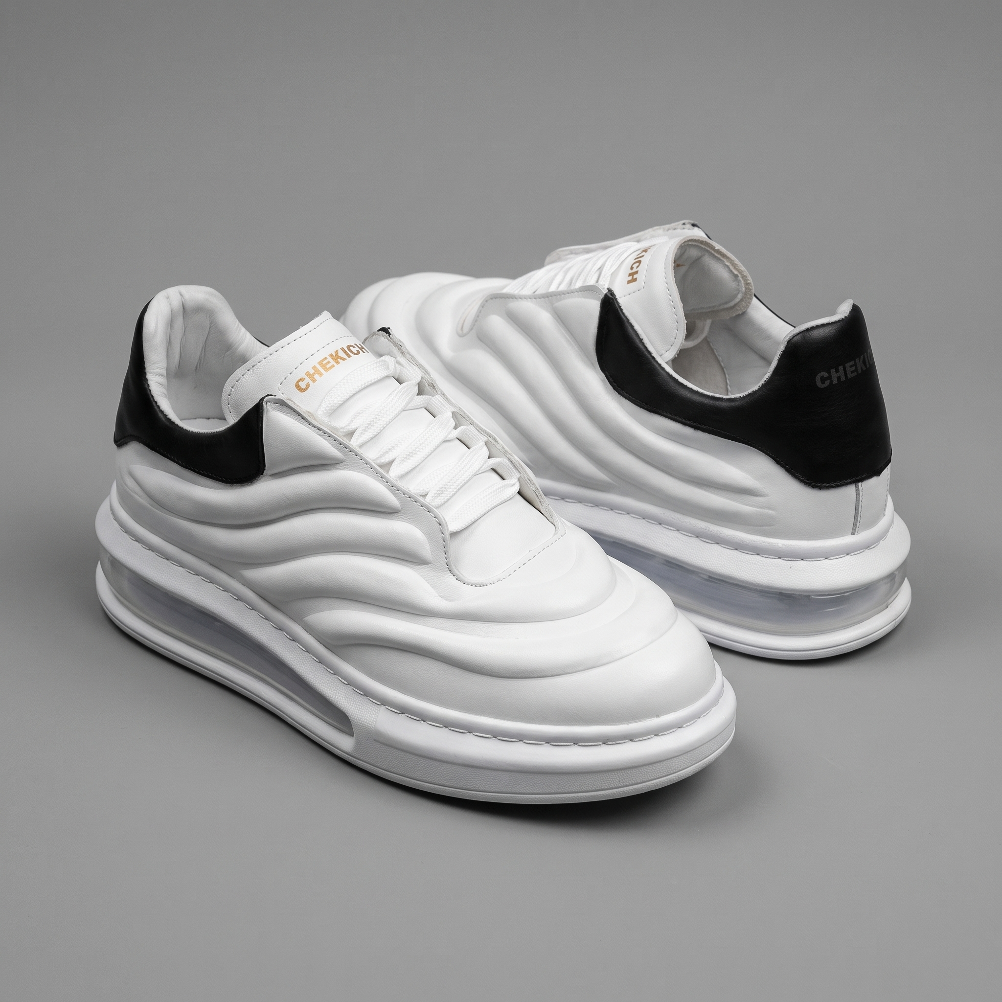 Chekich South Africa Astro white and black sneakers with stylish design and comfortable fit.