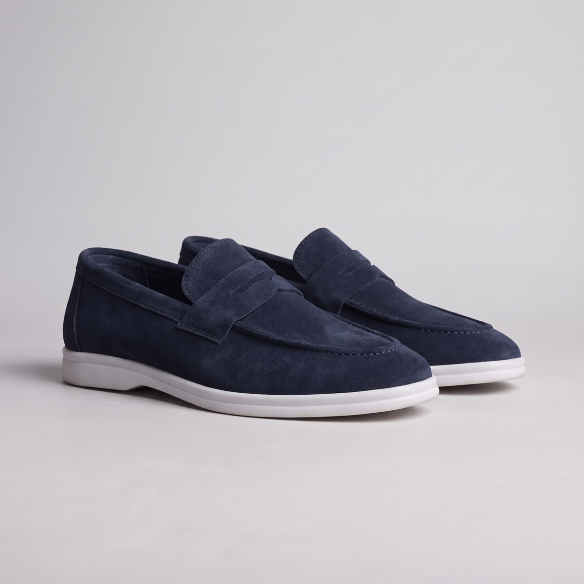 Chekich South Africa Clifton Navy sneaker showing side view with navy blue fabric and white sole.