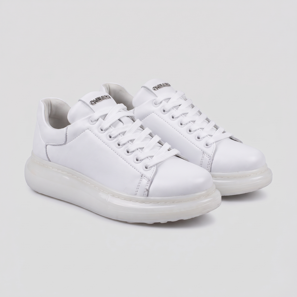 White Shopify Fantasia X sneakers with stylish design, showcasing the sleek silhouette and comfortable fit.