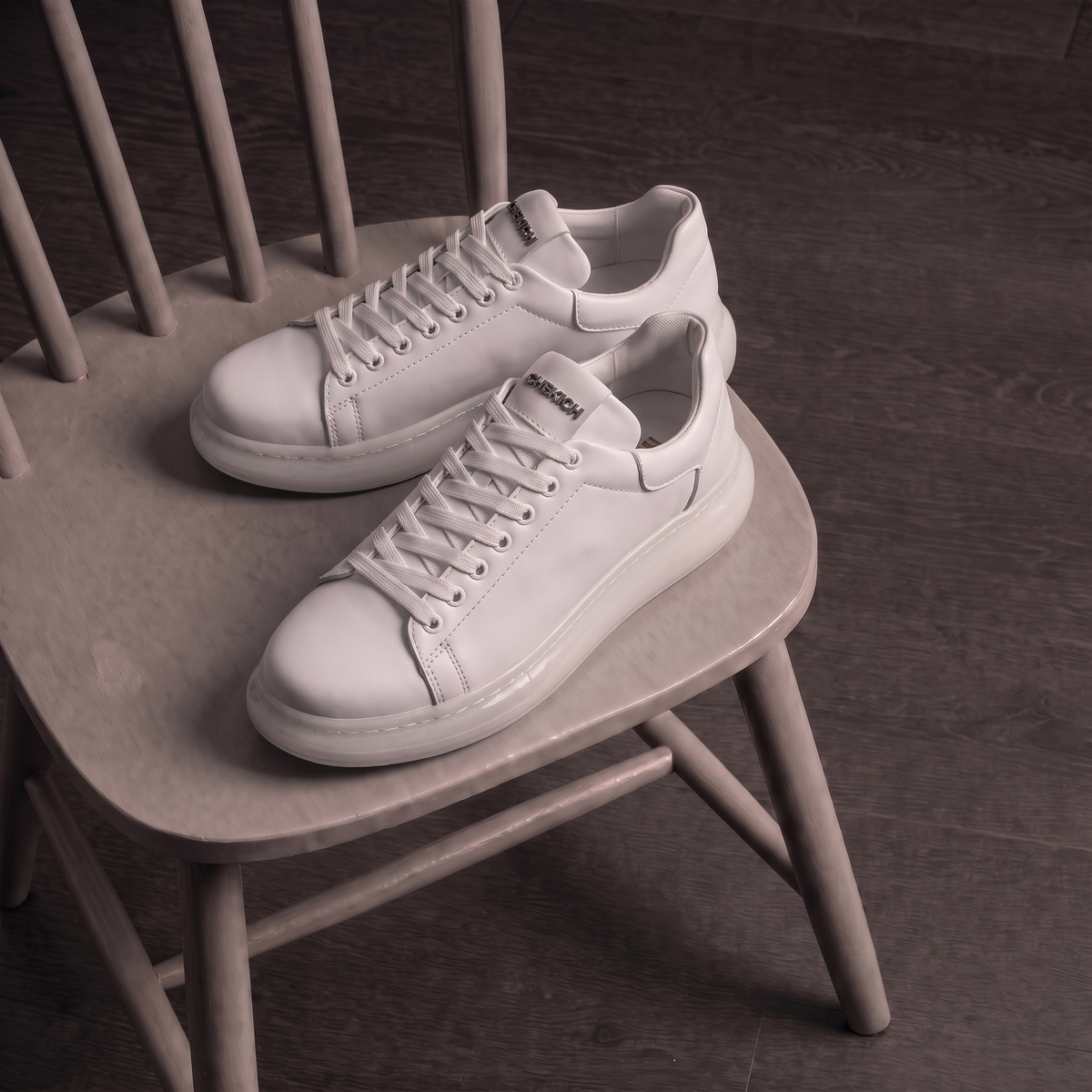 White FANTASIA X sneakers by Shopify with sleek design, lace-up closure, and cushioned sole for casual and athletic wear.