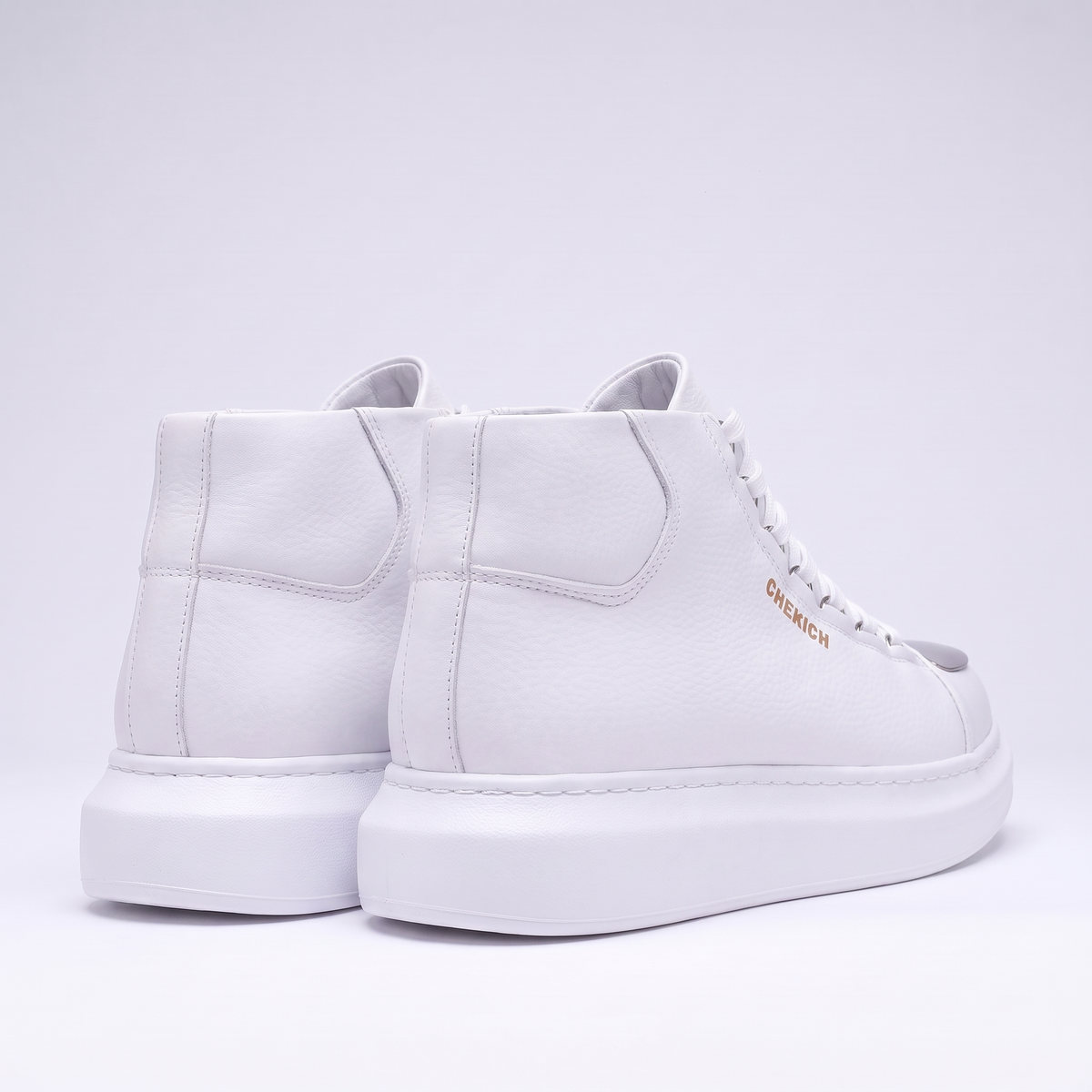 White Chekich Roma Mirror sneakers with sleek design and white laces, stylish footwear for casual wear.