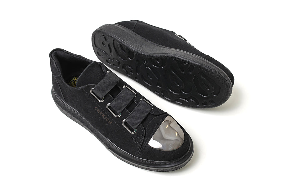 Black suede sneakers from Shopify with a sleek mirror finish, stylish design, and comfortable fit.