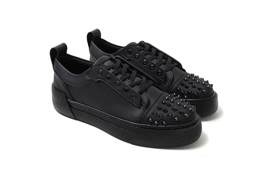 Black THORN Sneakers by Shopify featuring sleek design and comfortable fit, shown in a close-up image highlighting the shoe details.