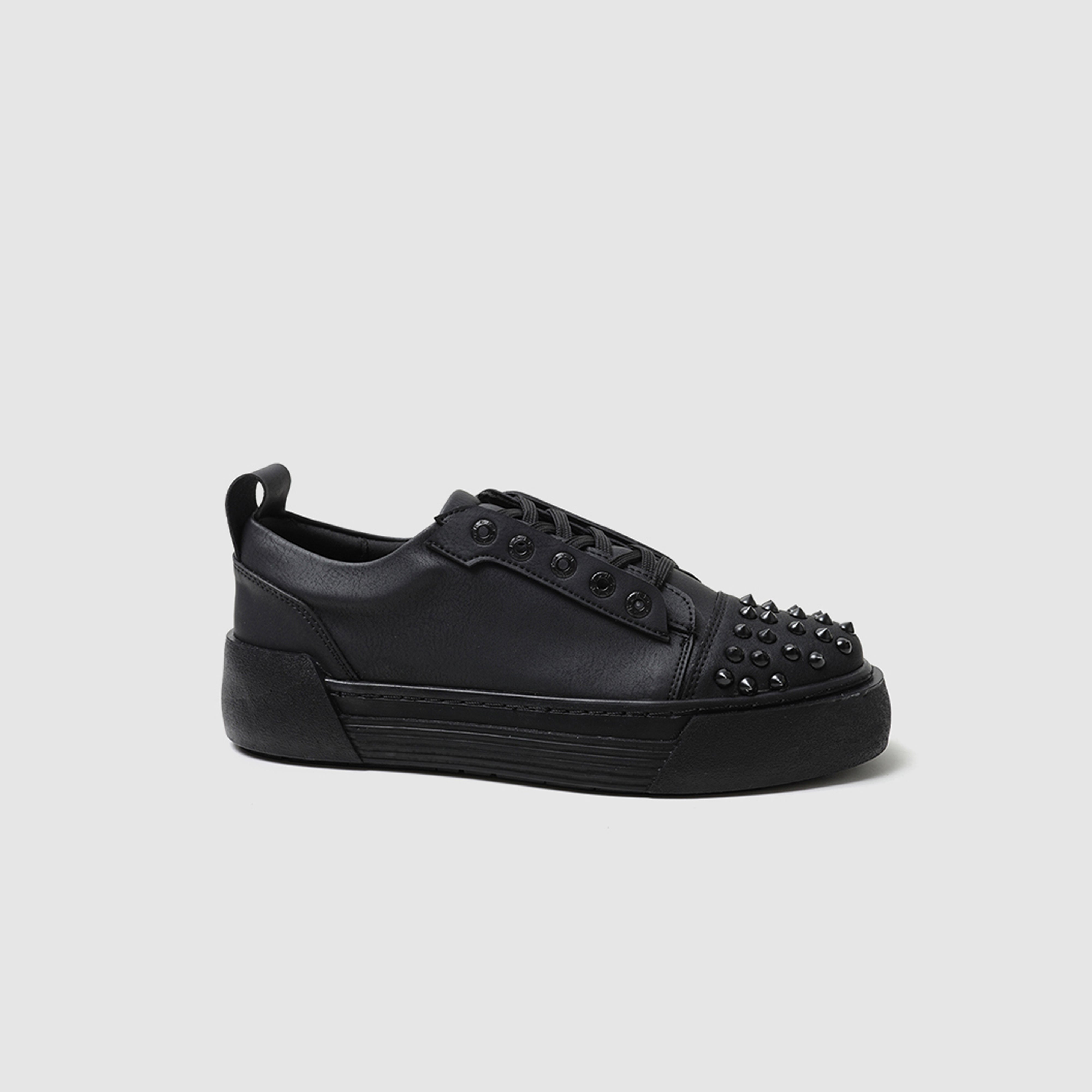Black THORN sneakers by Shopify with sleek design and matte finish, showcasing stylish athletic footwear for casual wear.