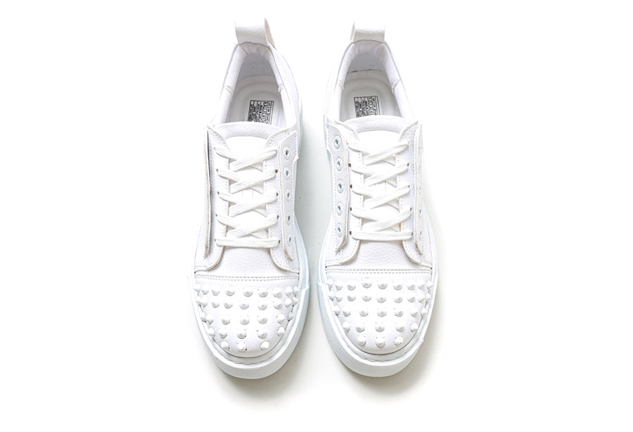 White Thorn sneakers by Shopify with clean design and white laces, showcasing casual style and comfortable fit.