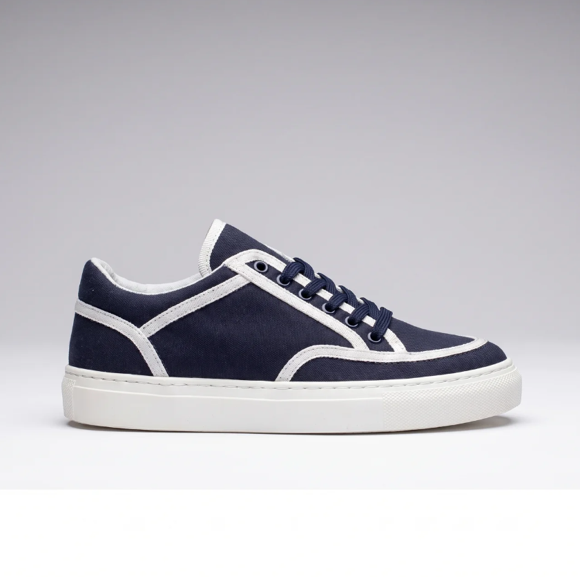Navy VAN sneakers by Shopify featuring a sleek design with navy blue color and white sole, casual footwear for everyday wear.