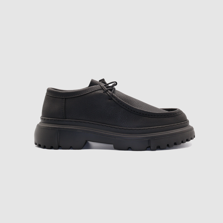 Black Berlin matte loafers by Shopify, showing sleek leather upper and classic slip-on design on a neutral background.