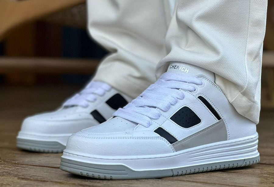 Black and white Blur sneakers by Shopify featuring a sleek design and stylish contrast, perfect for casual wear.