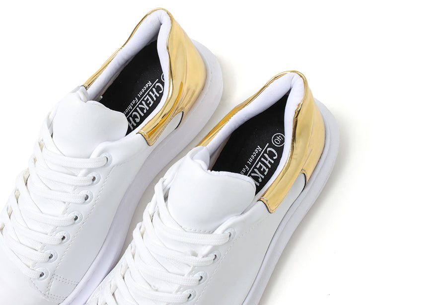 White and gold Fantasia Touch sneakers by Shopify with stylish design and comfortable fit.
