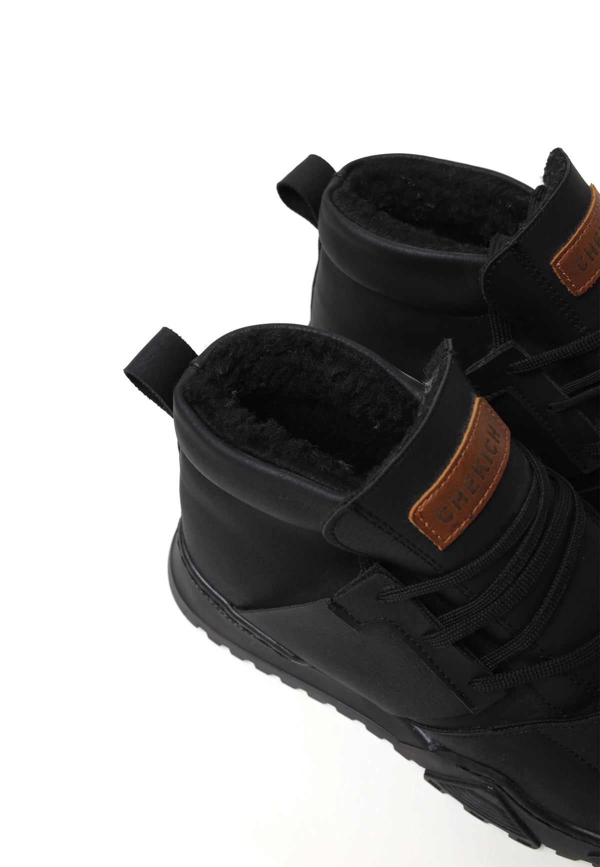 All black Ghost Line sneakers by Shopify, featuring sleek design and modern style, shown from a side view.