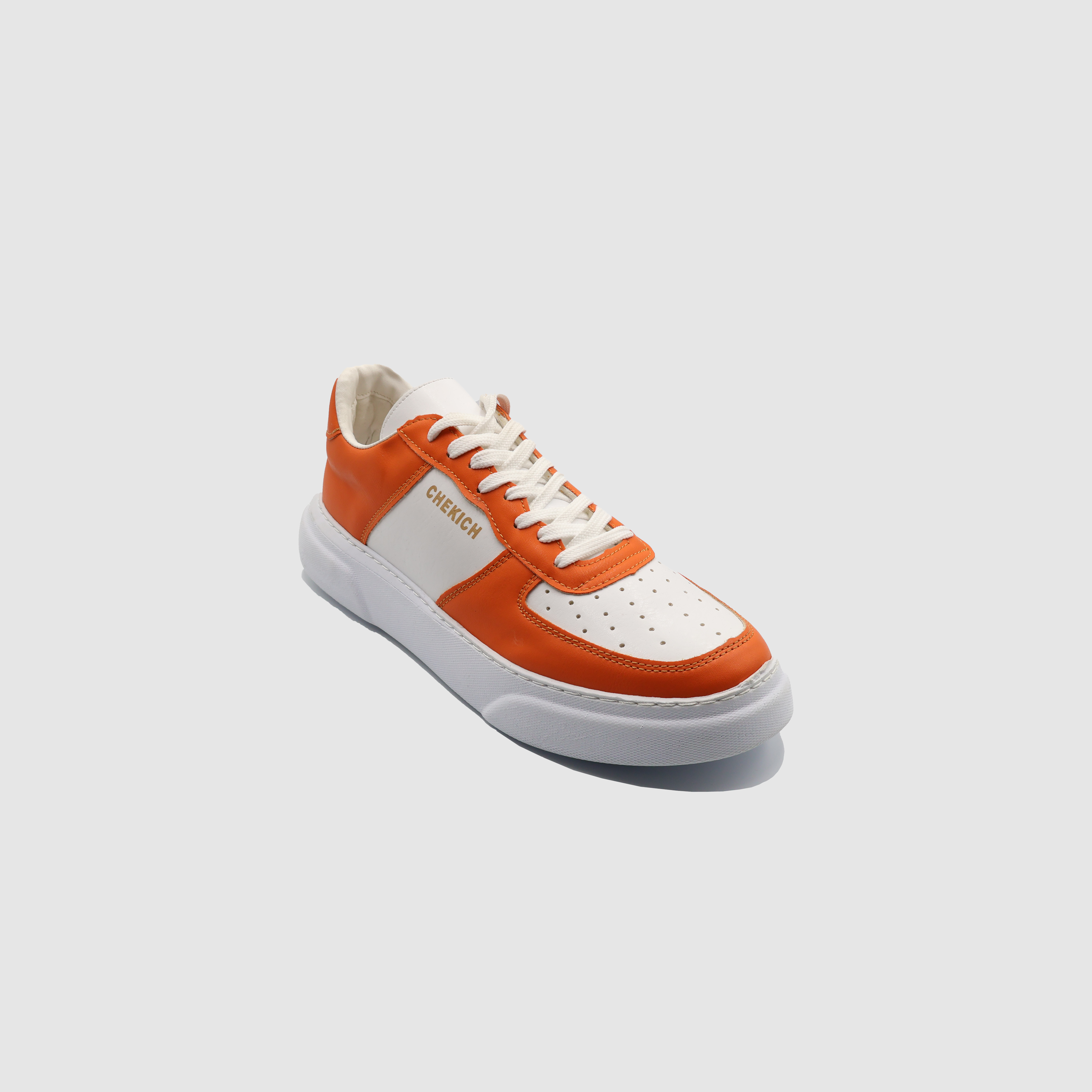 Orange Flatline sneakers by Shopify, casual low-top shoes with orange and white design, featuring laces and sporty style.