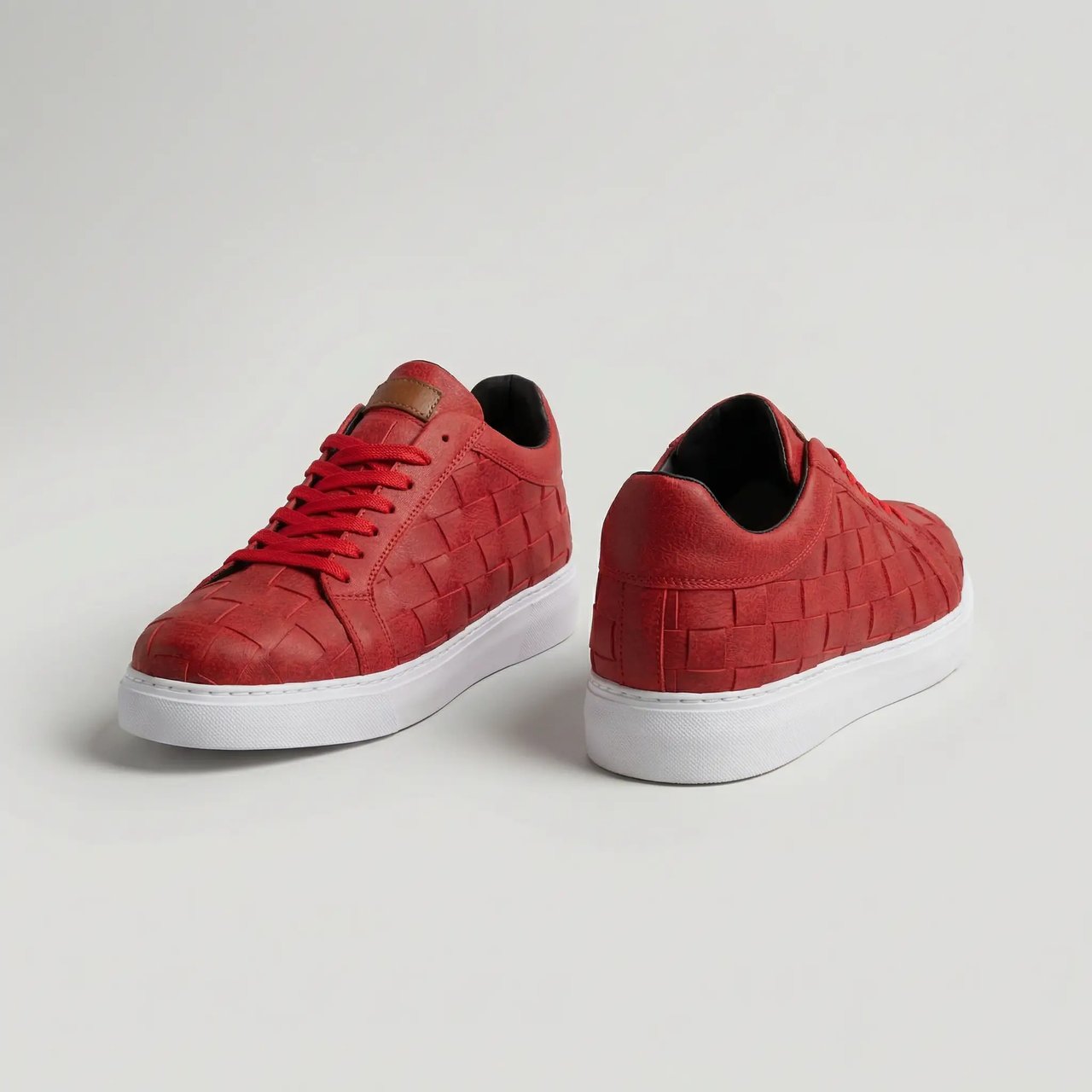 Red VIMINI sneakers by Shopify, stylish athletic shoes featuring a sleek design and comfortable fit.
