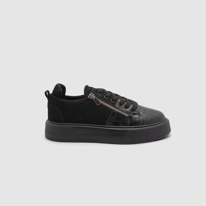 Black Phantom sneakers by Shopify with sleek design, featuring a low-top silhouette and modern athletic style.