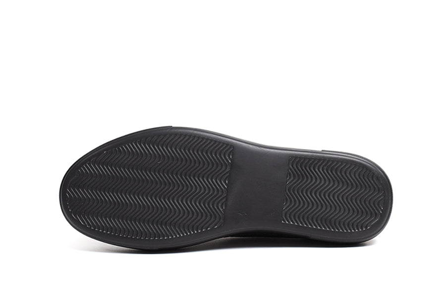 Black Pitti sneakers by Shopify featuring sleek design and white sole, displayed on a plain background.