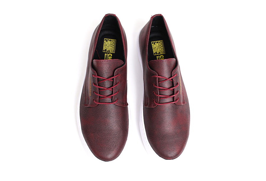Shopify Pitti Burgundy sneakers in a rich burgundy color, featuring a sleek design and comfortable fit.