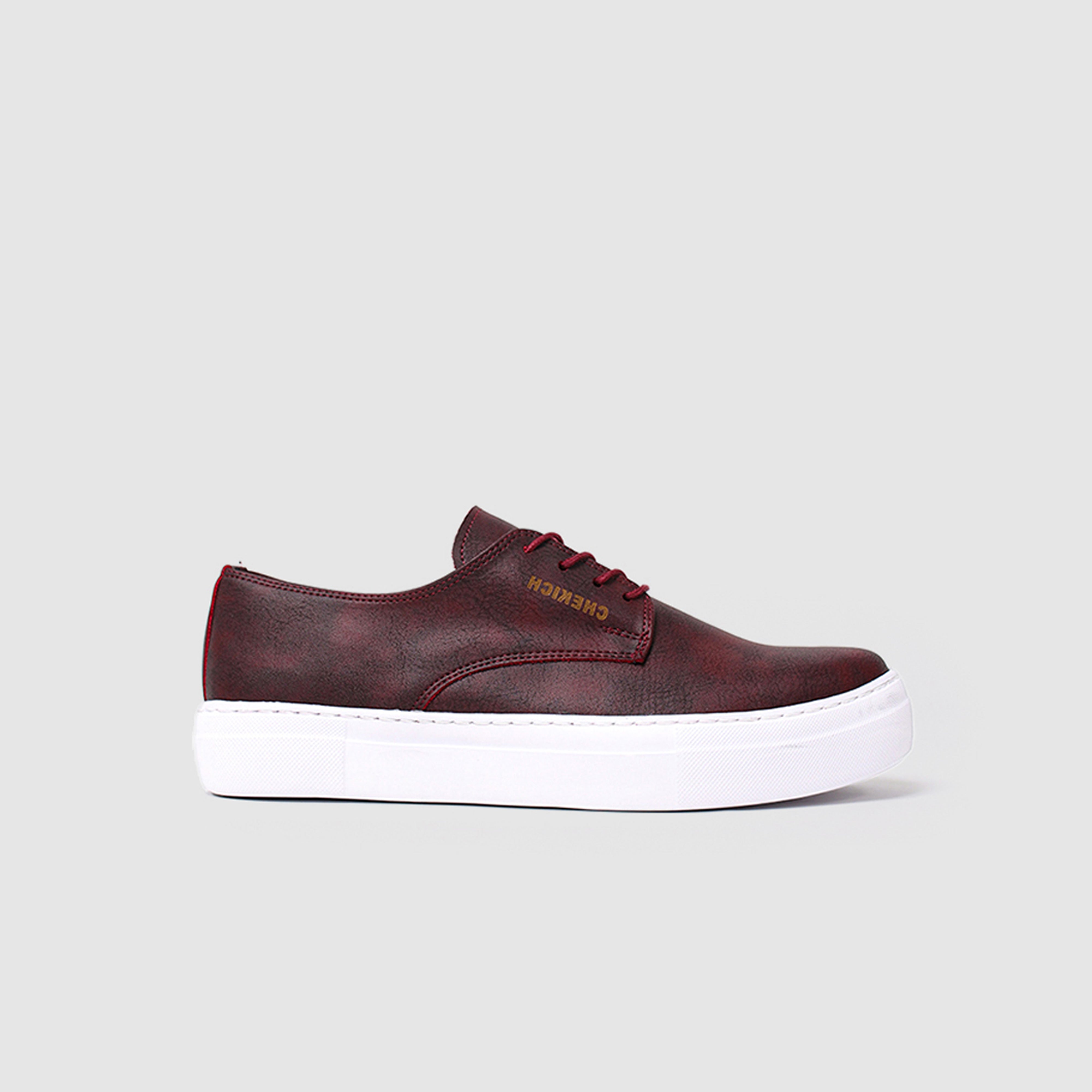 Shopify Pitti Burgundy sneakers in a rich burgundy color, featuring a stylish casual design with white sole detail.