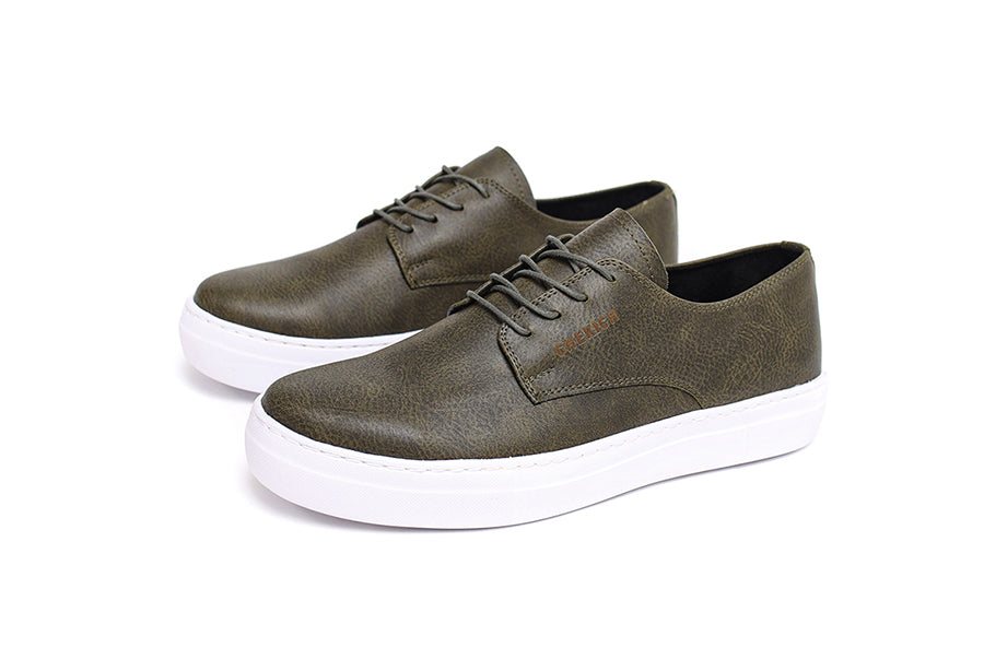 Green Pitti Sneakers by Shopify featuring stylish design and comfortable fit, shown from a side angle.