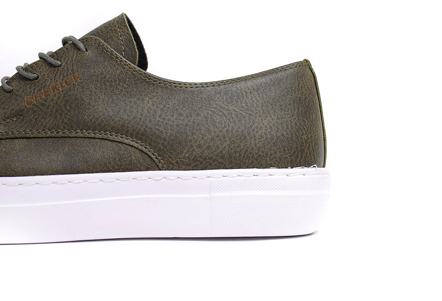 Shopify PITTI Green sneakers with vibrant green and white details, showcasing the stylish athletic footwear design.