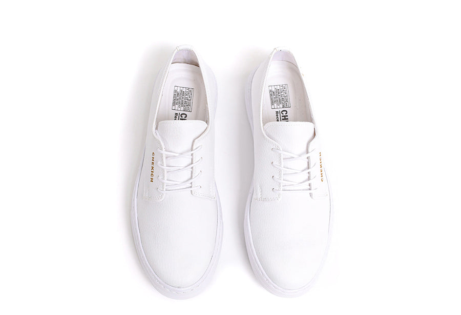White Pitti sneakers by Shopify, showcasing sleek design and clean laces on a white background.