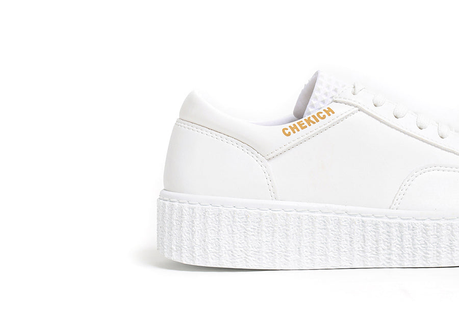 White Pyramid sneakers by Shopify featuring a sleek design, white laces, and modern athletic style.