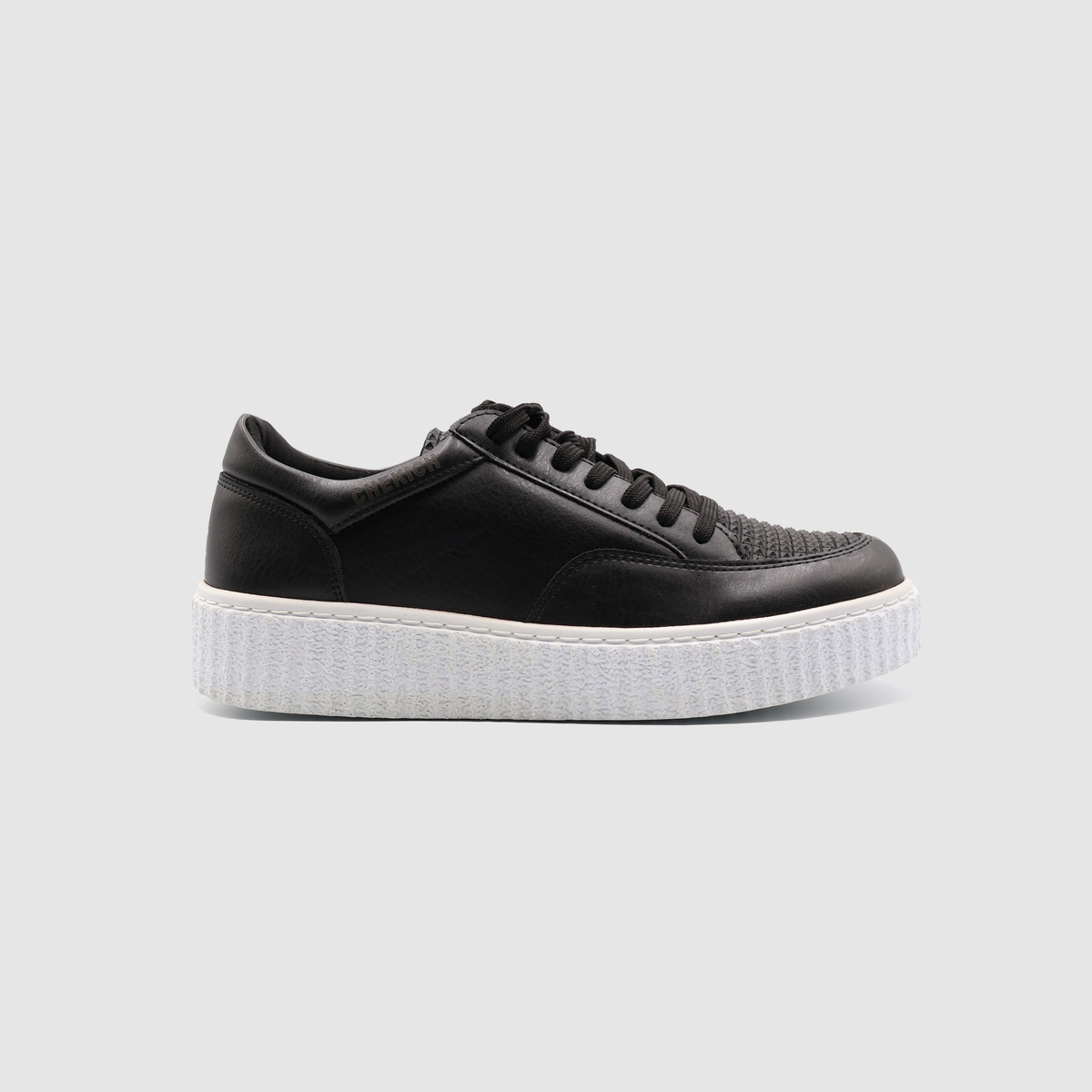 Black Pyramid sneakers by Shopify featuring a sleek design with white accents, shown from a side view.