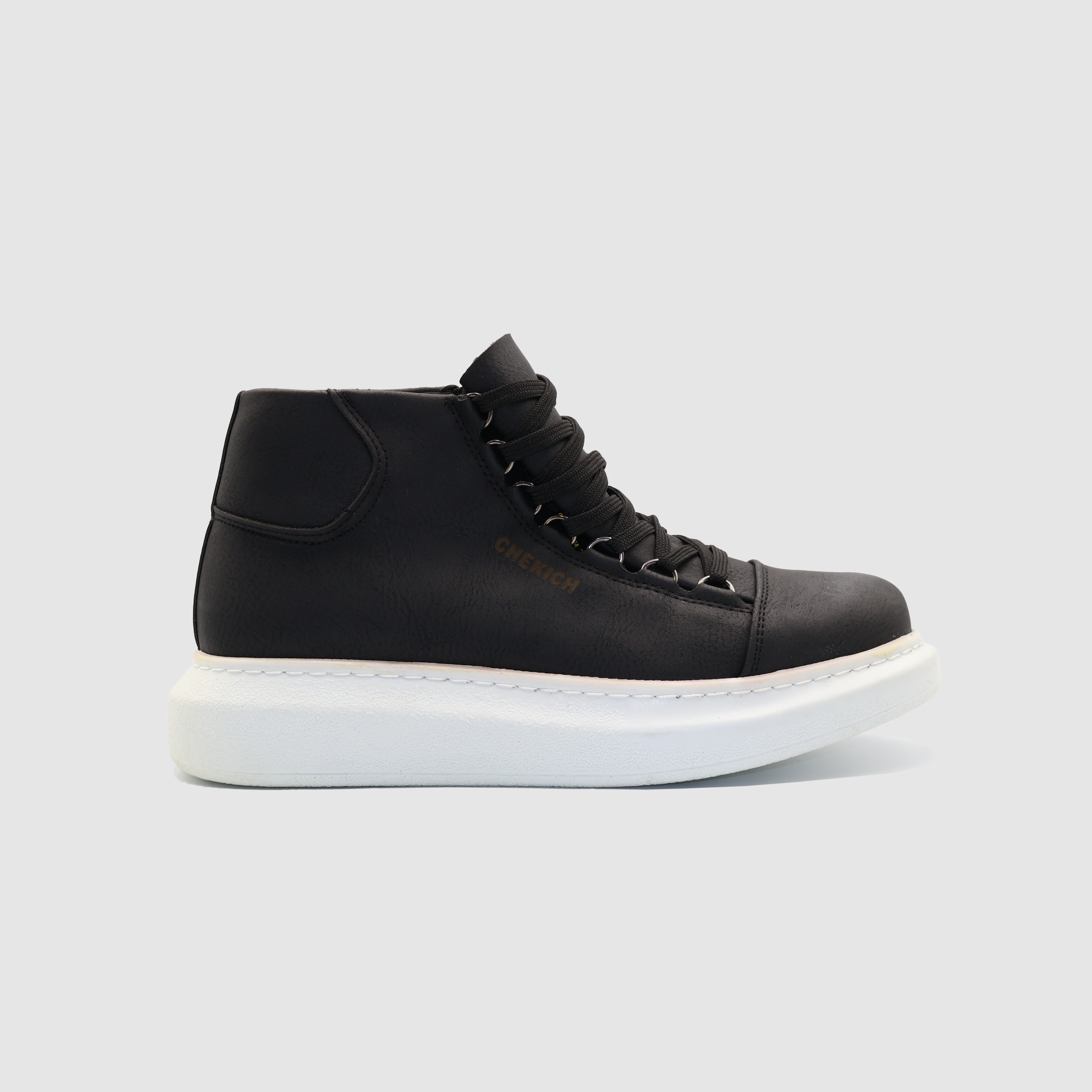 Shopify Roma Black boots with white accents, stylish ankle-length footwear featuring sleek leather design and modern silhouette.