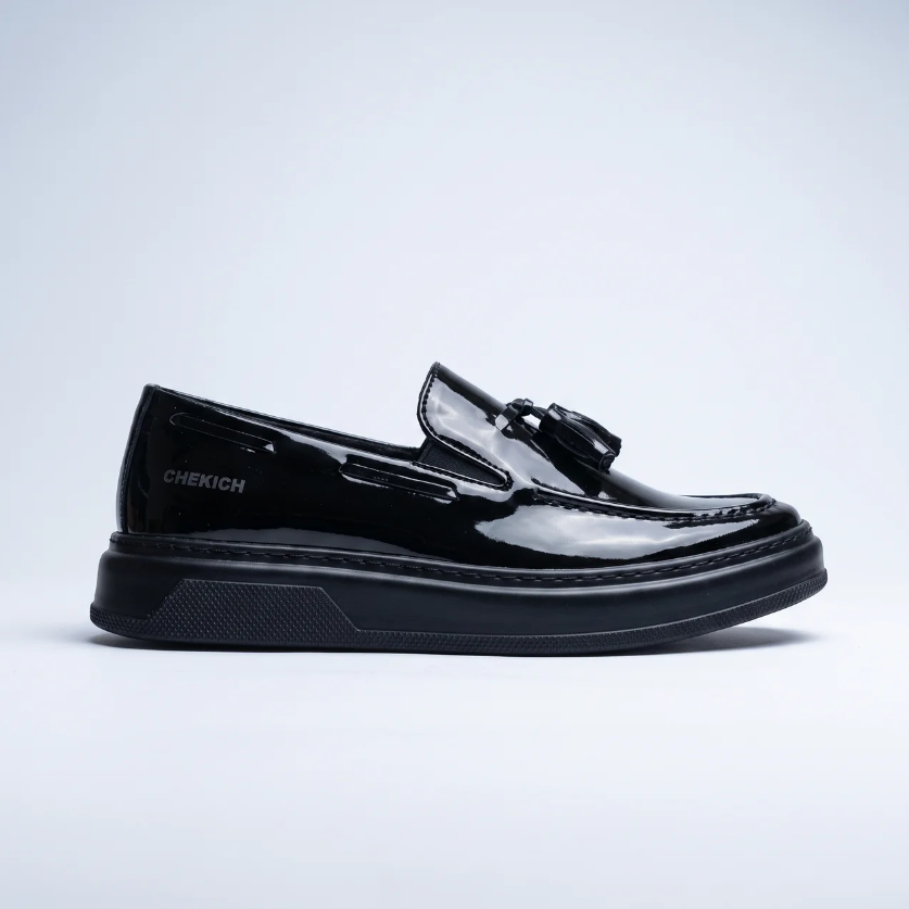 All black loafers by Shopify featuring sleek design and smooth leather finish, perfect for casual or formal wear.