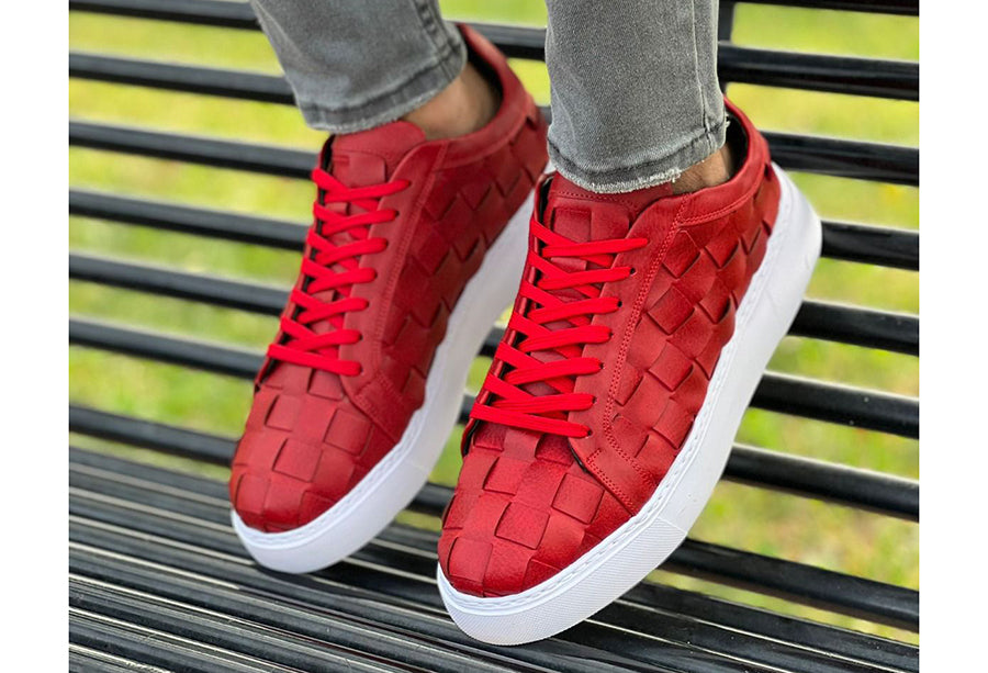 Red VIMINI sneakers by Shopify, featuring stylish design and comfortable fit, shown from a side angle.