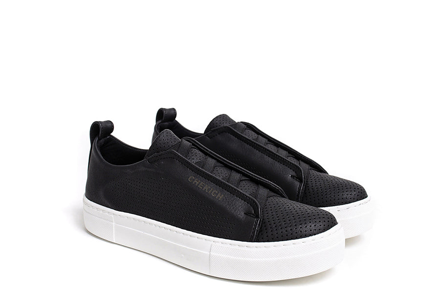 Black ZEN Sneakers by Shopify featuring sleek design and comfortable fit, shown from a side angle.