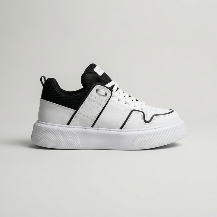 White and black Shopify BLADE sneakers with sleek design and lace-up closure, shown from a side angle.