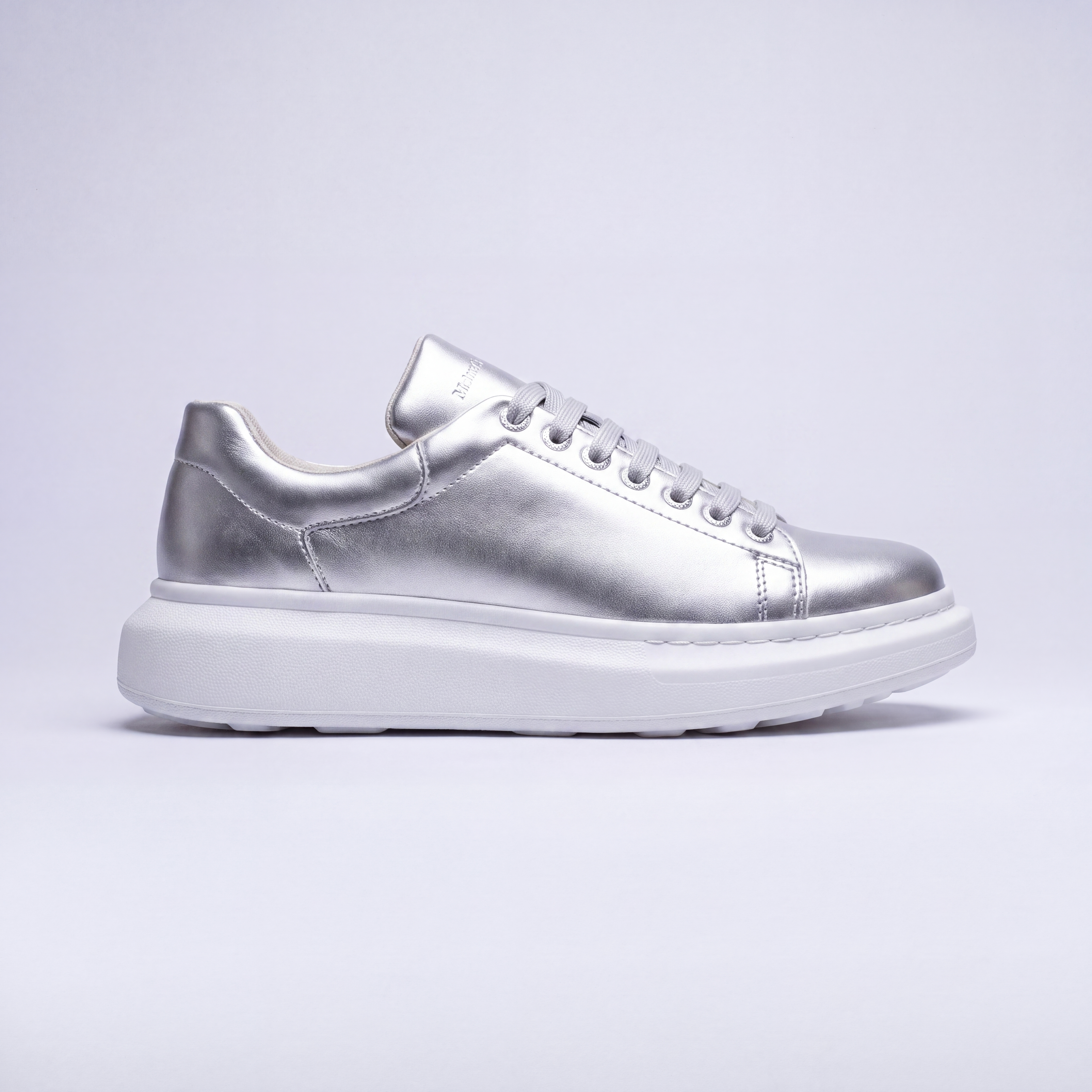 Silver FANTASIA EX sneakers by Shopify featuring stylish design and comfortable fit, shown on a clean white background.