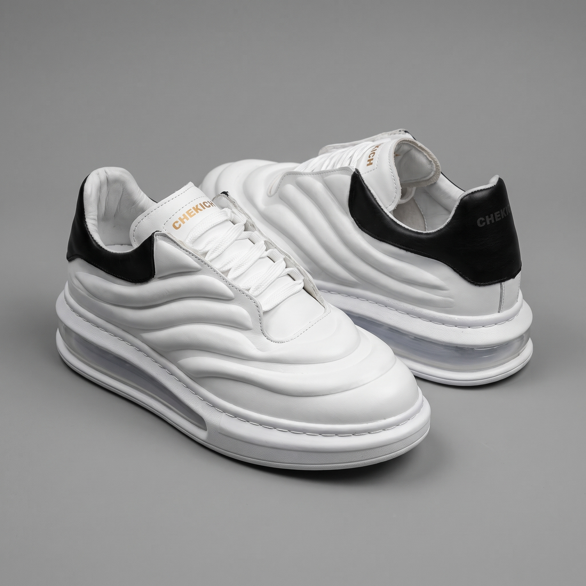 Chekich South Africa Astro white and black sneakers with stylish design and comfortable fit.