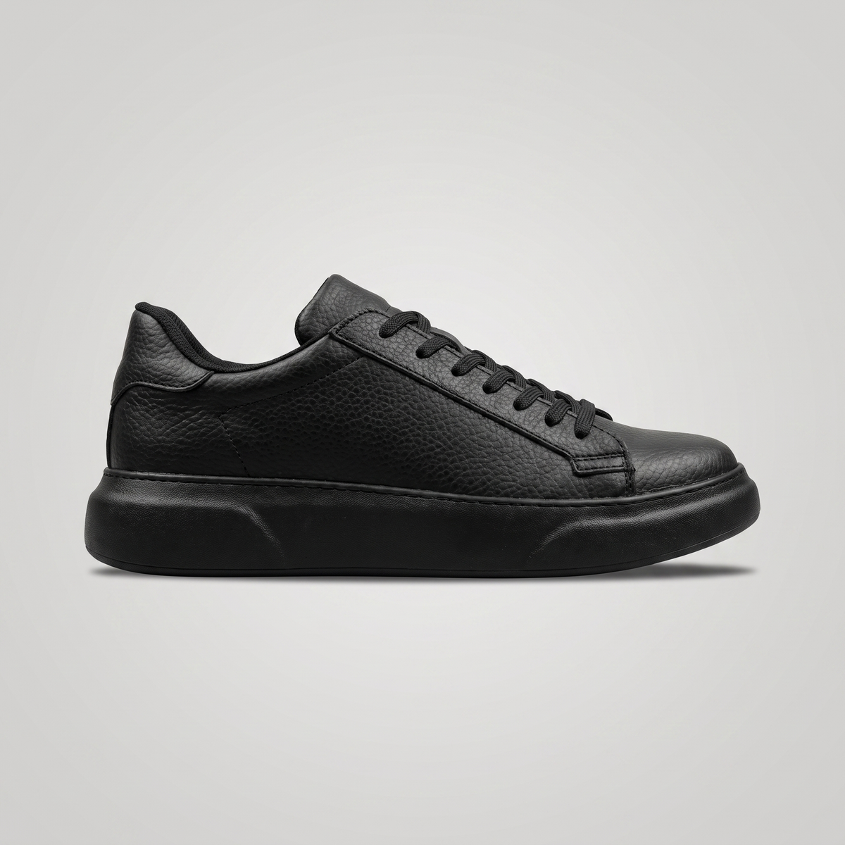 Black FOCUS Chekich South Africa shoe with sleek design and subtle branding, showing the front view with laces and smooth finish.