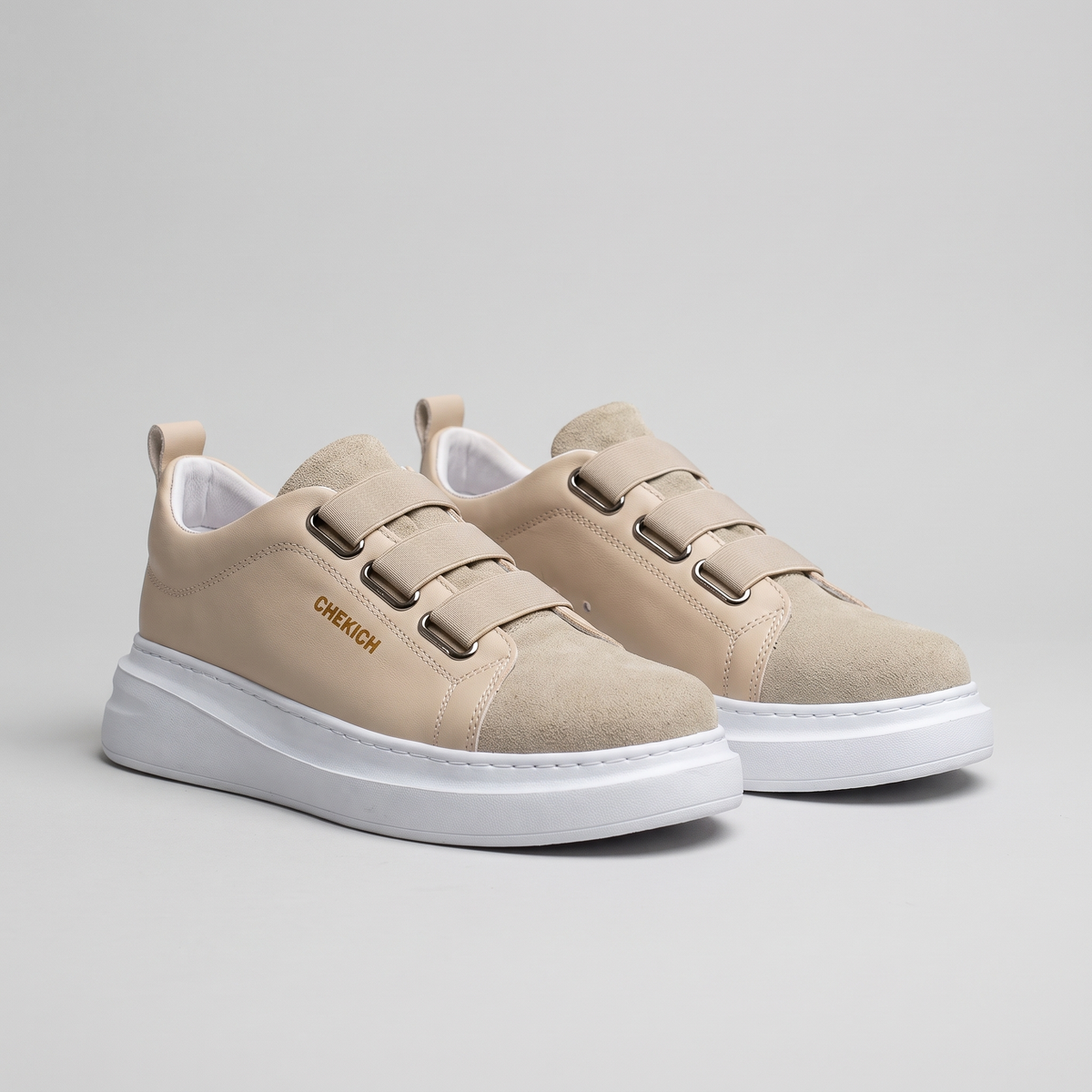 Chekich NONE V2 Cream sneakers pair, three-quarter view showing the three hook-and-loop straps and white sole