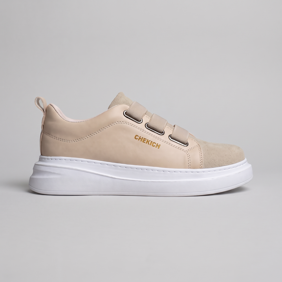 Chekich NONE V2 Cream sneakers, side view of the triple-strap upper with suede toe panel on a white platform sole