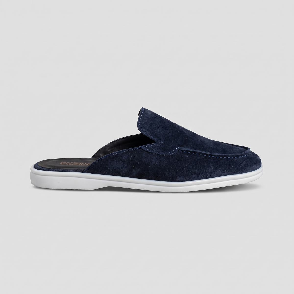 Chekich South Africa Clifton Mule in navy with pointed toe and sleek design, displayed on a neutral background.